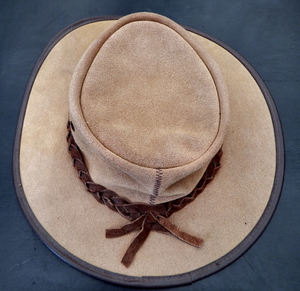 his winter hat1: man's suede leather winter hat - top back view with leather thonging