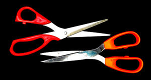 scissors6: variety of old and used scissors - general household scissors with orange thermoplastic handles,