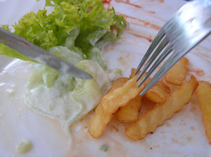 Eating: A plate with a fork and knife. Tasty french fries!Please mail me or comment this photo if you decide to use it.  Thanks in advance for letting me know!I would be extremely happy to see the final work even if you think it is nothing special! For me it is (