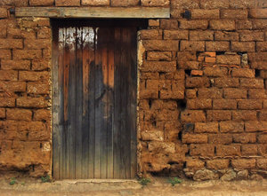 Old Wooden door: Old wooden door in an adobe made house. 