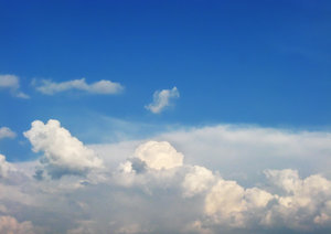 Fluffy Clouds: White fluffy clouds on blue sky 