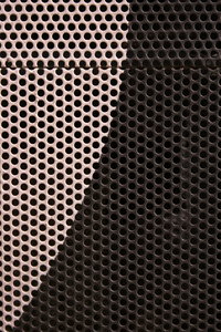 Metal Grill: Close-up of metal grill with holes