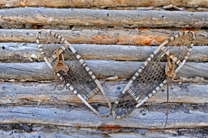 Snowshoes on Cabin: taken in Yellowknife, NWT - vintage log cabin
