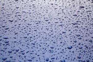 Water Droplets: Water drops on a metallic blue car