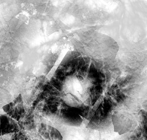 Grunge - Cobwebs on old Photo: Grungy black and white photo of a child's face covered with cobwebs.