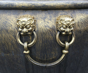 Urn handle: Ornamental handle of a large scraped gold urn in the Forbidden City, Beijing, China.