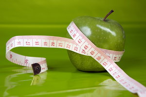 perfect figure: apple with centimeter,greenbackground