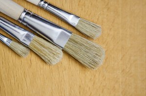 Brushes on wooden background