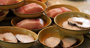 fish steaks: cut up fish steaks or cutlets ready for purchase at fish market