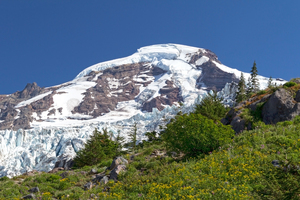 Snowy summer mountain: The snow capped peak of Mt Baker, USA, in the summer.