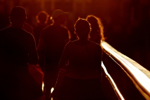 People walking in sunset