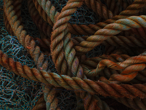Nets: A fisherman's ropes and nets, piled on a wharf