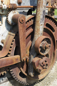 Old machinery: Corroded parts of an old press for making bricks in Bedfordshire, England.