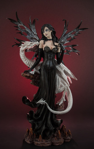 Dark angel with dragon statue: A picture of a dark angel with a white dragon